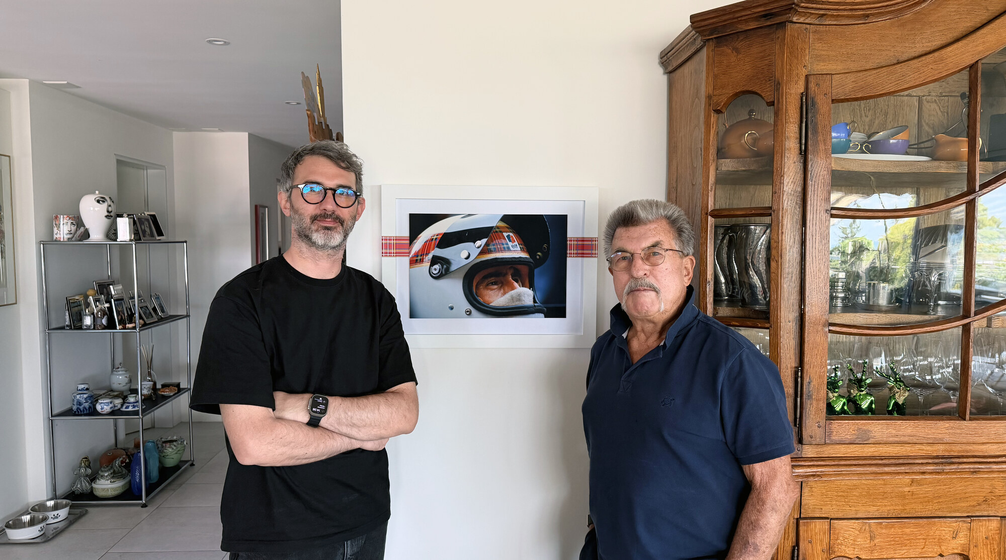 Rainer W. Schlegelmilch, right, with Devis Gastaldon, founder, left, beside a Framebook showing the helmet spread.