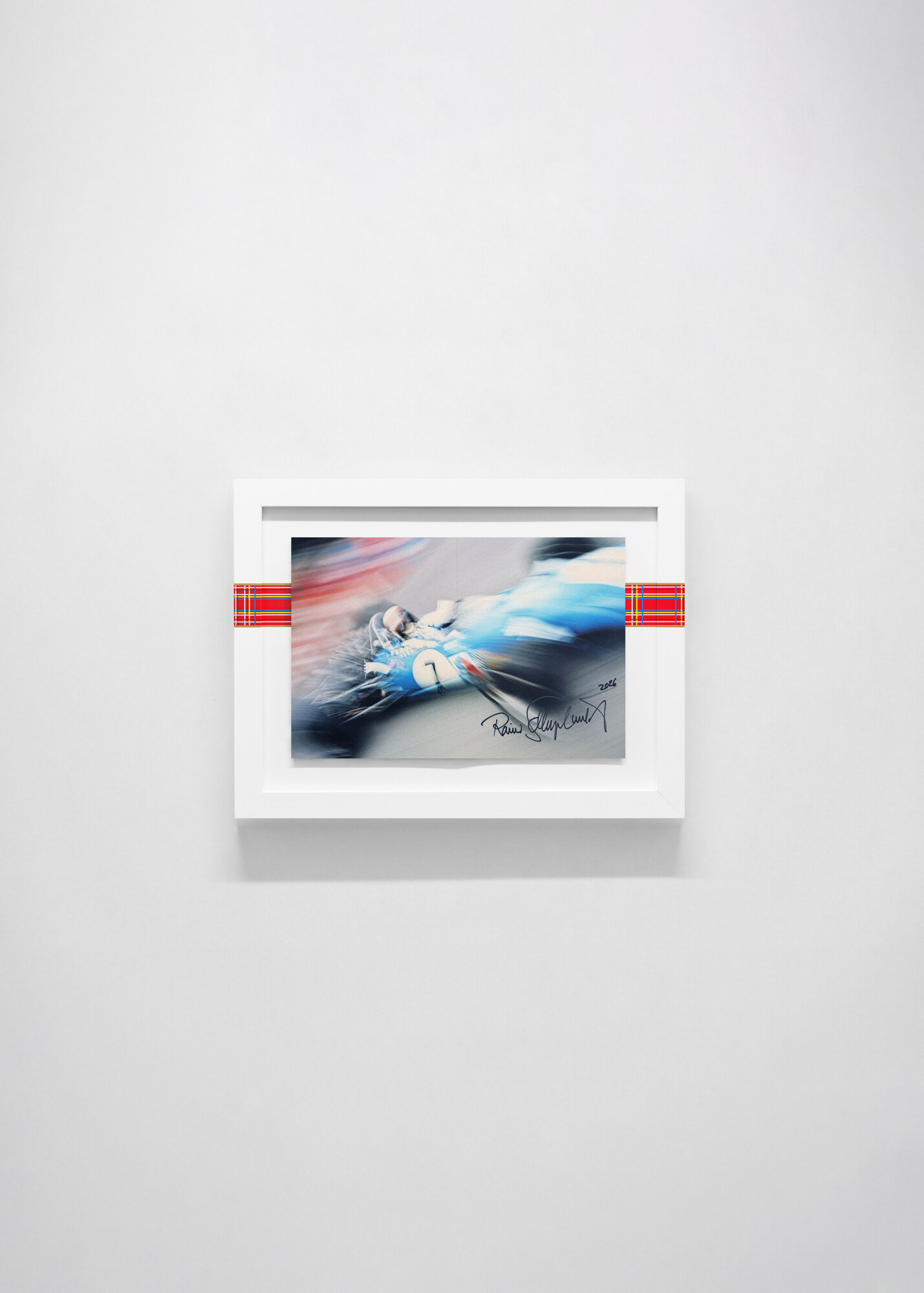 Visualisation, not a photograph. The motion-blur spread, signed and dated, on a white wall.